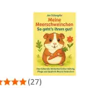 Ein süßes Meerschweinchen hält eine Karotte. Das Buch "Meine Meerschweinchen" erklärt, was fressen Meerschweinchen und wie sie glücklich sind.
